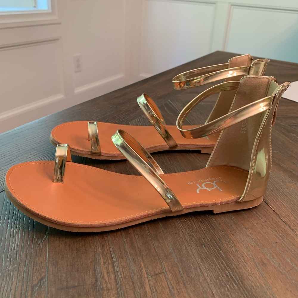 Gold flat sandals….brand new….without the box.